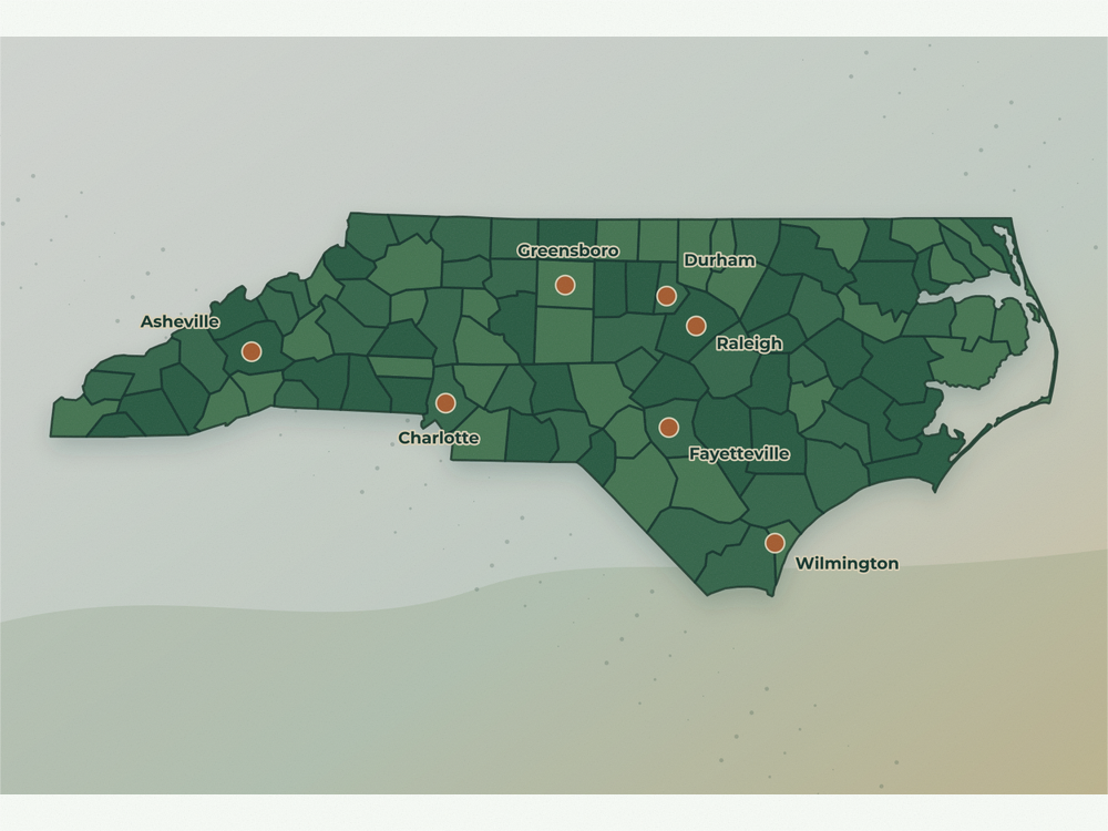 Accurate North Carolina land service area map showing Charlotte, Raleigh, Greensboro, Durham, Asheville, Fayetteville, and Wilmington